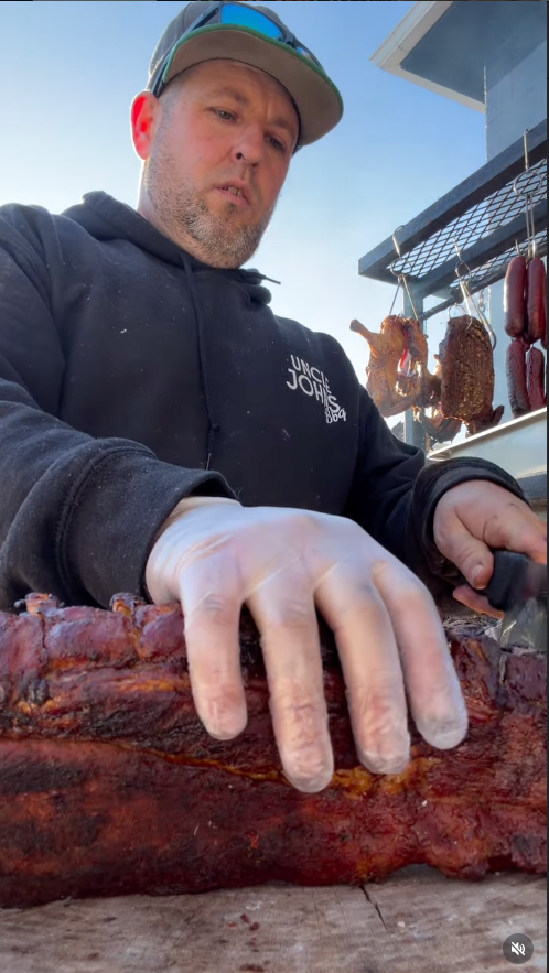 Uncle John slicing meat